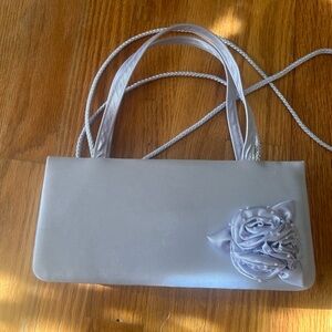 April Cornell

Elegant Evening Silver/gray Satin Bag with Rose Embellishment